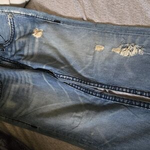 Distressed Blue Denim Jeans